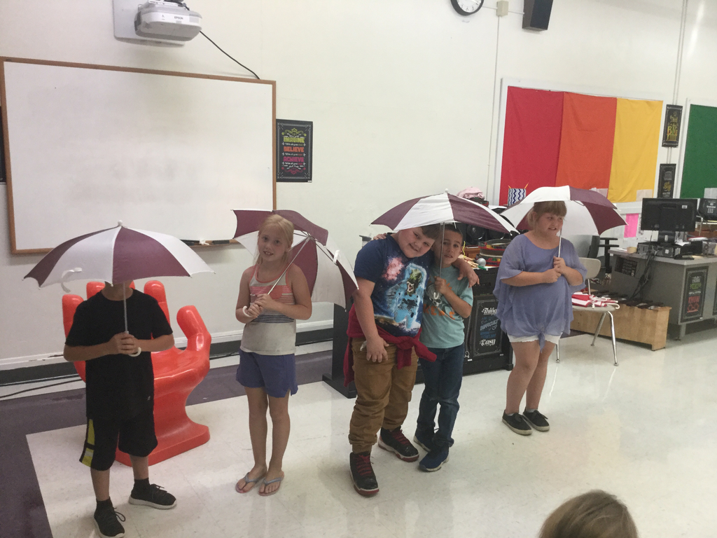 Second graders figure out the rhythm of Rain Rain Go Away.